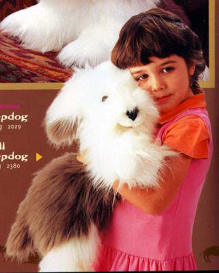 Selina posing in catalog with puppets - 2002