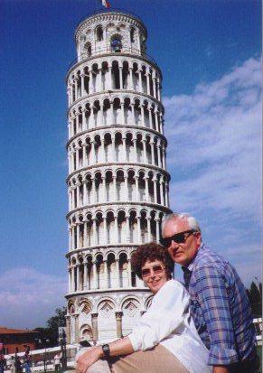 Joy and Ray on the grass in front of the tower on a beautiful, sunny day!